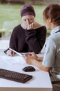 Doctor showing medical records to cancer patient Royalty Free Stock Photo