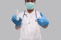 Doctor Showing Nose Spray and Thumb up Wearing Medical Mask and Gloves Close Up. Indian Man Doctor Nasal Spray. Corona Virus