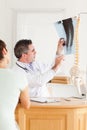 Doctor showing a patient a x-ray Royalty Free Stock Photo