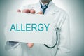 Doctor showing a signboard with the word allergy