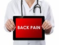 Doctor showing tablet with BACK PAIN text