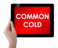 Doctor showing tablet with COMMON COLD text. Royalty Free Stock Photo
