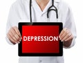 Doctor showing tablet with DEPRESSION text Royalty Free Stock Photo