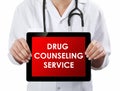 Doctor showing tablet with DRUG COUNSELING SERVICE text.