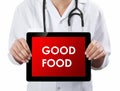 Doctor showing tablet with GOOD FOOD text.