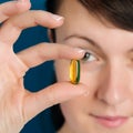 Doctor showing vitamin oil capsule Royalty Free Stock Photo