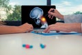 Doctor showing a x-ray of skull with pain in the neck on a laptop to a woman patient. Headache migraine or trauma concept