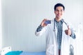 The doctor shows the credit card in his hand To show ideas about paying medical bills by credit card Royalty Free Stock Photo