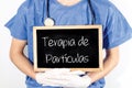 Doctor shows information on blackboard: particle therapy in Portuguese. Medical concept