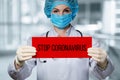 Doctor shows a sign saying stop coronavirus Royalty Free Stock Photo