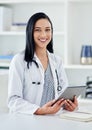 Doctor, smile and portrait of woman with tablet in office for telehealth, feedback or online research. Healthcare