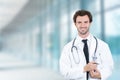 Doctor smiling standing in hospital hallway clinic Royalty Free Stock Photo
