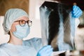 Doctor specialist pulmonary medicine holding radiological, chest x-ray film for medical diagnosis on patient health on infected Royalty Free Stock Photo