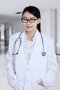 Doctor standing in corridor Royalty Free Stock Photo