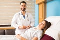 Doctor standing next to patient in a hospital Royalty Free Stock Photo