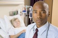 Doctor Standing In Patients Room