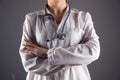 a doctor with a stethascope stands crossed hands Royalty Free Stock Photo