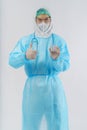 Doctor PPE uniform holding coronavirus covid-19 vaccine bottle on hand Royalty Free Stock Photo