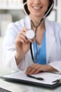 Doctor with a stethoscope in the hands, close up. Physician ready to examine and help patient. Medicine, healthcare and Royalty Free Stock Photo