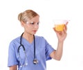 Doctor with stethoscope holding urine sample Royalty Free Stock Photo