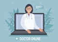 A doctor with a stethoscope on a laptop screen talks to a patient online. Medical consultations, exams, treatment, services, Royalty Free Stock Photo