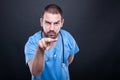 Doctor with stethoscope making watching you gesture Royalty Free Stock Photo