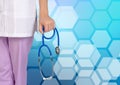 Doctor with stethoscope on medical honecomb background