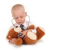 Doctor With Stethoscope and Teddy Bear as a Patien Royalty Free Stock Photo