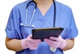 A doctor with a stethoscope works remotely via the Internet in a tablet, Royalty Free Stock Photo