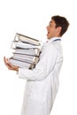 Doctor on stress with stacks of files. Bureaucracy