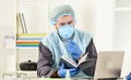 Doctor studying. Coronavirus outbreak. Latest scientific findings and knowledge on coronavirus disease. Learn how Royalty Free Stock Photo