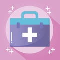 Doctor suitcase with a cross on pink background