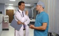 Doctor and surgeon consulting