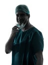 doctor surgeon man portrait with face mask smiling friendly silhouette Royalty Free Stock Photo