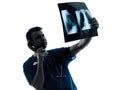 Doctor surgeon radiologist phone examining x-ray Royalty Free Stock Photo