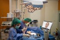 doctor surgery patient in operating room in hospital and talk ,consult with specialist doctor by telepresence robot during emerge