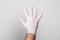 Doctor in surgical gloves. Male hand in latex glove