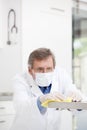 Doctor with surgical mask cleaning a surgery in a hospital