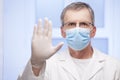 Doctor with surgical mask gesturing stop for covid-19 Royalty Free Stock Photo