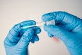 A laboratory employee taking sample PCR microtubes with cotton swab test. Diagnostic testing for COVID-19. The concept Royalty Free Stock Photo