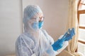 Doctor with a syringe administering medicine at home during a pandemic