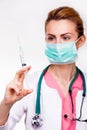 Doctor with syringe and stethoscope Royalty Free Stock Photo