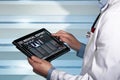Doctor with tablet data consulting a medical report of a patient