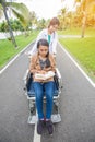 Doctor takes a patient on wheelchair