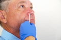 The doctor takes a test for coronavirus from the man`s nose Royalty Free Stock Photo