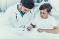 Doctor Taking Blood Sample from Boy`s Finger. Royalty Free Stock Photo