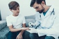 Doctor Taking Blood Sample from Boy`s Finger. Royalty Free Stock Photo