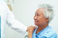 Doctor taking care, help and encourage Asian elder senior woman patient in clinic hospital Royalty Free Stock Photo