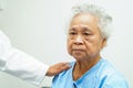 Doctor taking care, help and encourage Asian elder senior woman patient in clinic hospital Royalty Free Stock Photo