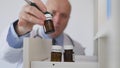 Doctor Taking a Medicament from Medical Cabinet in Hospital Room Royalty Free Stock Photo